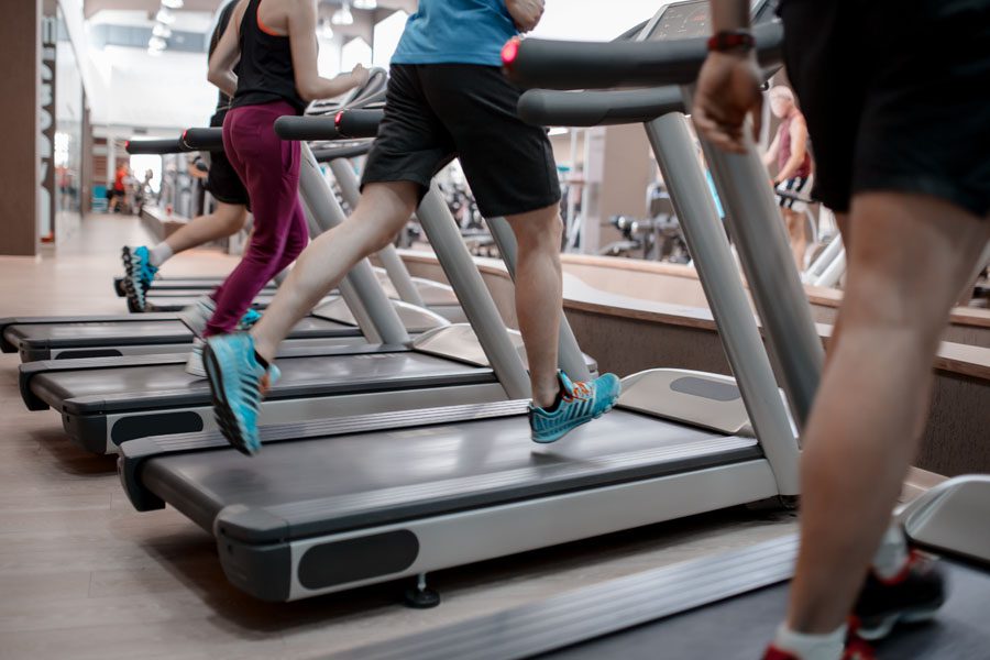Fitness Center Insurance - People Running on the Treadmill at the Gym